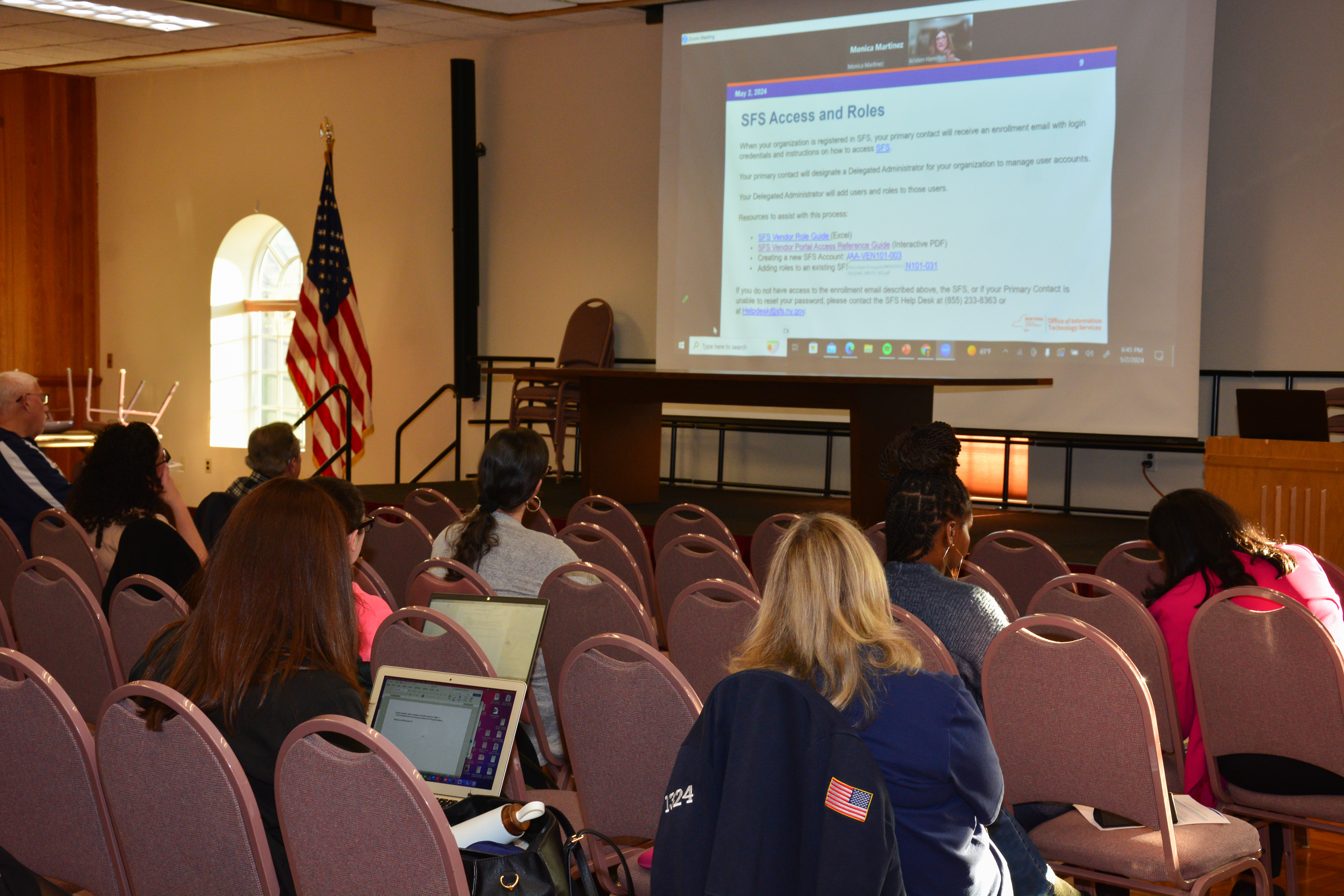 Participants of a grant writing workshop sponsored by NYS Senator Monica R. Martinez receive information about the state grant process.