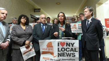 New York State Senator Monica R. Martinez discusses the importance of saving community journalism during a press conference held in Albany.
