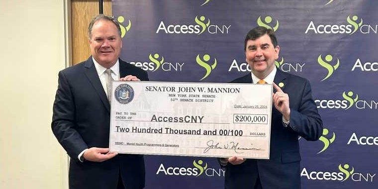 Senator John Mannion and AccessCNY Executive Director Paul Joslyn announce $200,000 for children's mental counseling and upgrades to housing units for people with disabilities.