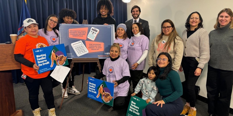 Image of Senator Andrew Gounardes standing with families and advocates for the Working Families Tax Credit