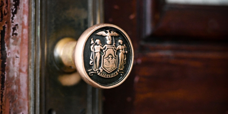 New York State seal embossed door knob in the capitol.  