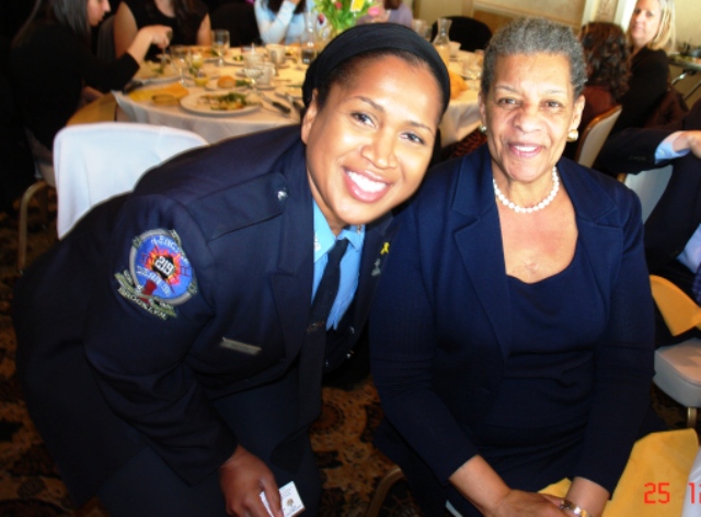 Senator Ruth Hassell-Thompson with a member of Engine Company 93 in ...