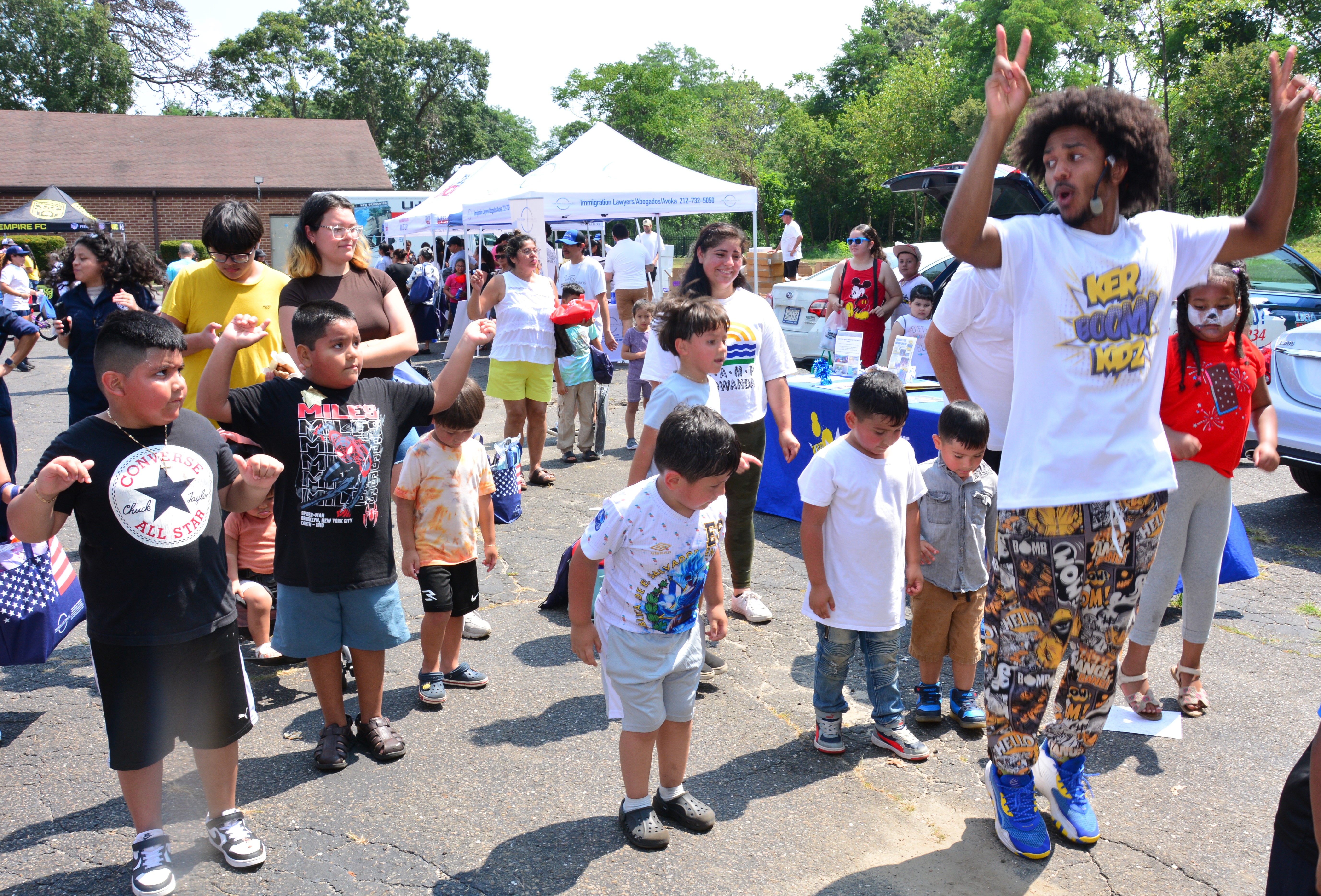Photo of children dancing during a backpack and school supply distribution event in Brentwood on Saturday, Aug. 16, 2025.