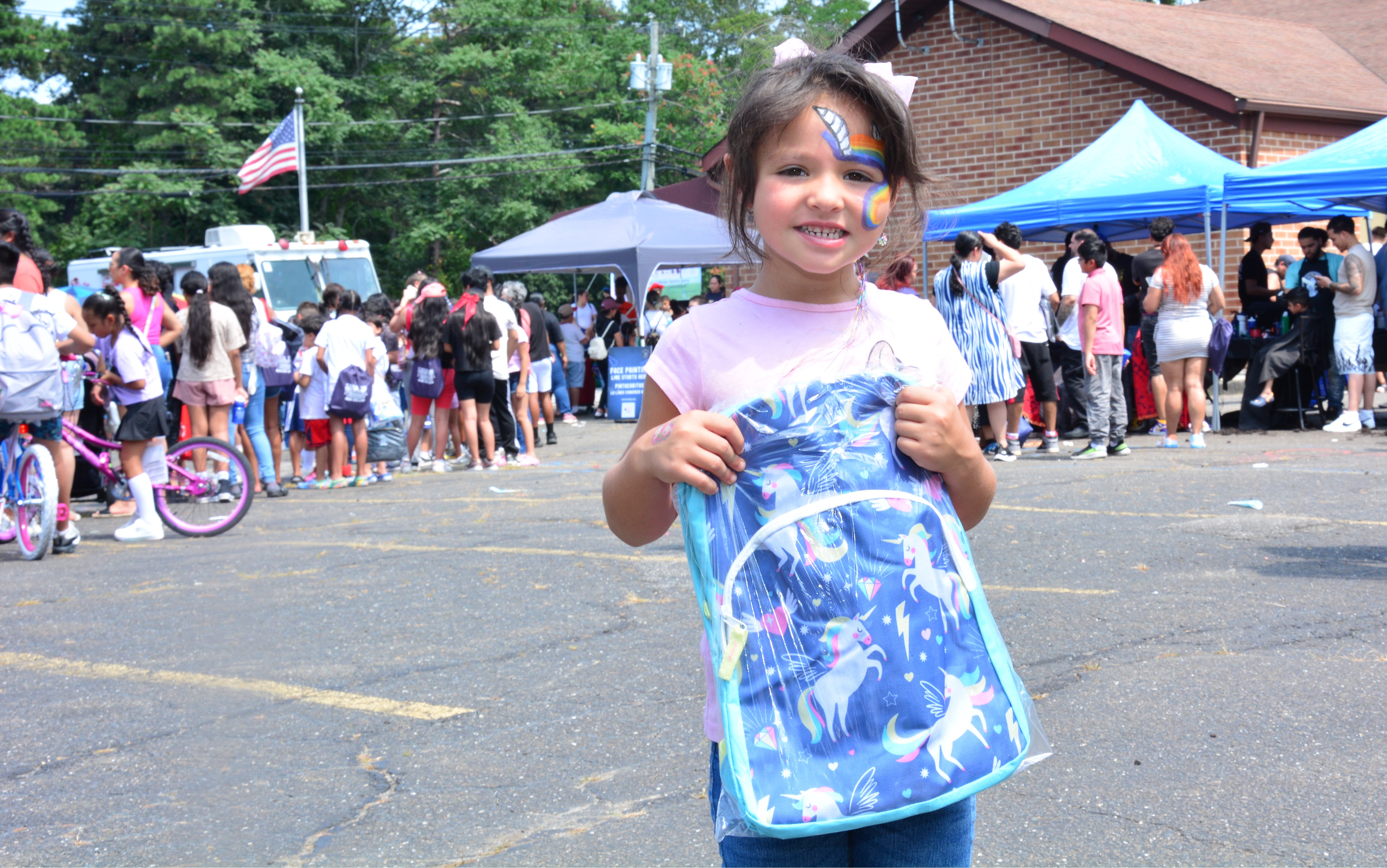 Photo of student with a new school backpack at the Brentwood backpack and school supply event on Saturday, Aug. 16, 2025.