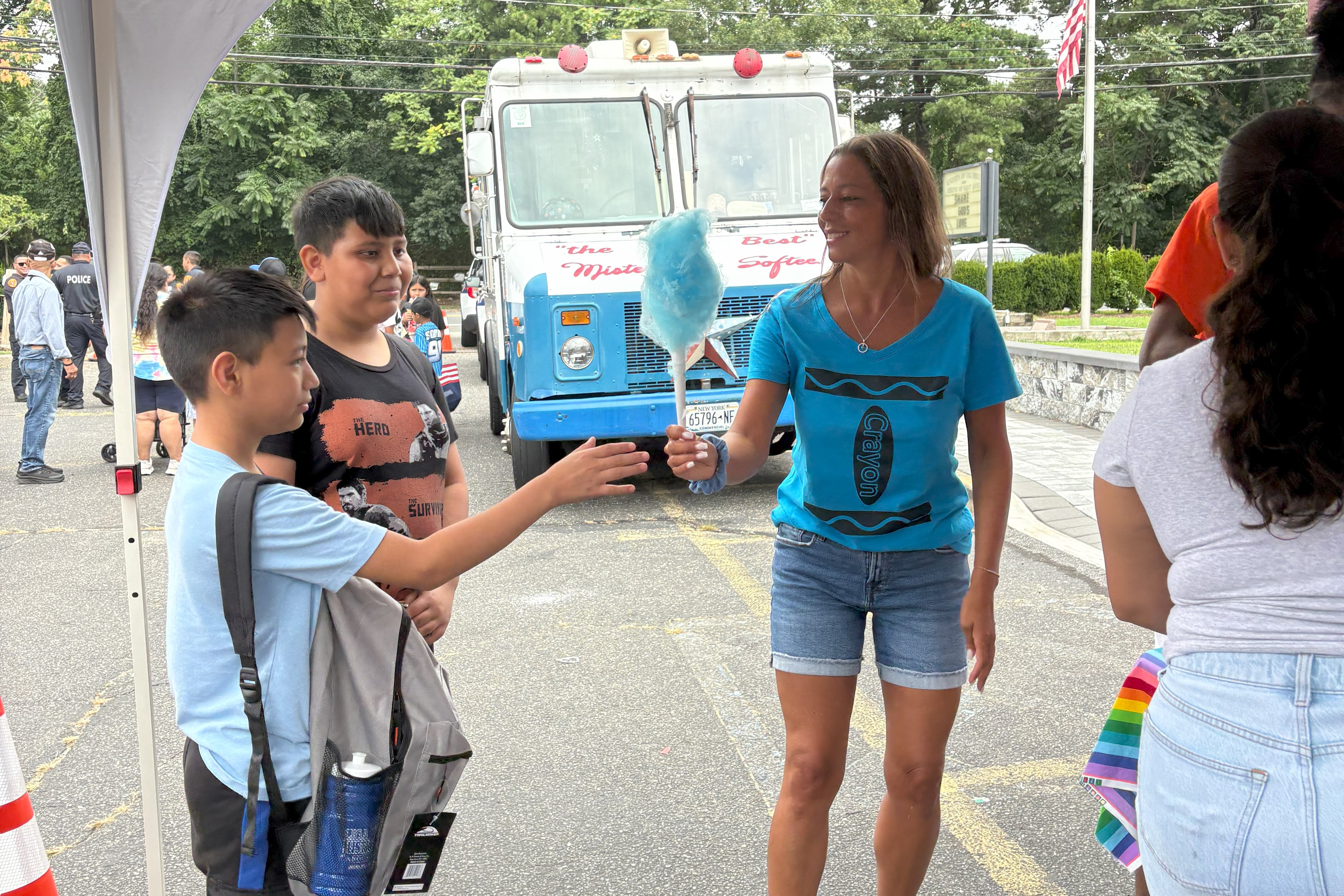 Sen. Martinez hands out Cotton Candy during a backpack and school supply event in Brentwood on Saturday, Aug. 16, 2025.