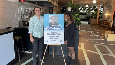 Senator Gianaris with a staffer from Nowadays and a sign