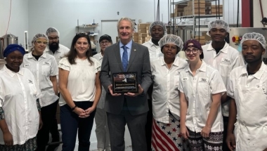 Senator Sean Ryan presents a New York State Senate Empire Award to the staff at Watson's Chocolates
