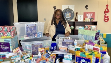 Senator Lea Webb with donated school supplies