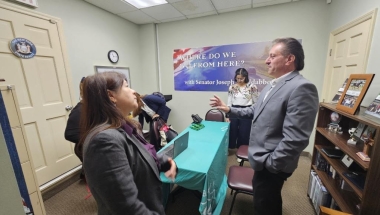 Senator Addabbo speaks with representatives from QARI.
