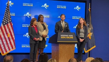 Senato Andrew Gounardes stands alongside Attorney General Letitia James and Governor Kathy Hochul to push for protections for kids on social media.