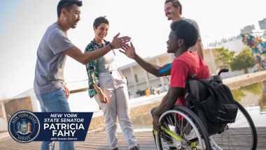 People welcoming their friend in a wheelchair