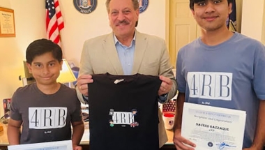 Senator Addabbo presents citations to Adeeb and Naveed Razzaque.