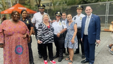 Senator Krueger stands with officers and community members from the 17th Precinct
