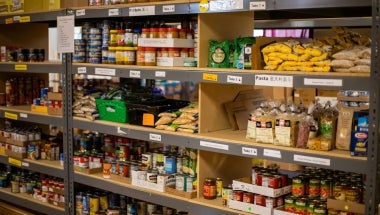 Photo of food pantry shelf with food items on it.