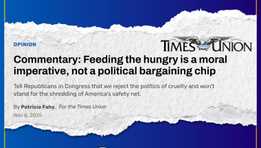 Newspaper rip-out with text: Commentary: Feeding the hungry is a moral imperative, not a political bargaining chip (headline for op-ed in Times Union) overlayed