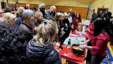 Attendees intently watched the cooking demonstration by Cornell University Cooperative Extension, NYC.