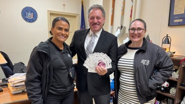 Senator Joseph P. Addabbo, Jr. receives gift cards from the community from Local 338 RWDSU Representatives.