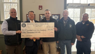 Senator Ryan stands with Onondaga County Parks representatives to present a $50,000 grant check