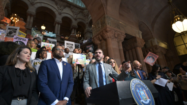 Senator Andrew Gounardes rallying in support of his New York For All Act.