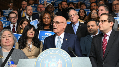 Senator Sutton speaks from the podium