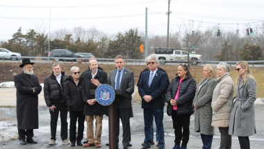 Sen. James Skoufis, joined by state and local politicians announces efforts to alleviate congestion at a busy Monroe-Woodbury intersection. 