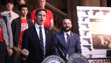 State Sen. Erik Bottcher and Assembly Member Keith Powers discuss the bill with gun safety advocates on March 10, 2026