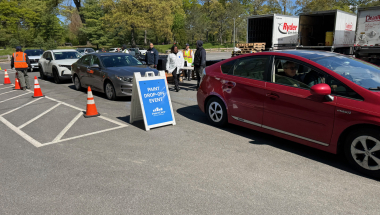 Cars lined up to drop off e-waste and paint.