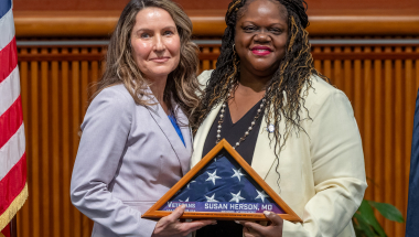 Senator Webb and Dr.Susan Herson holding the flag