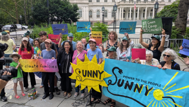 Senator Krueger stands with advocates supporting the SUNNY Act