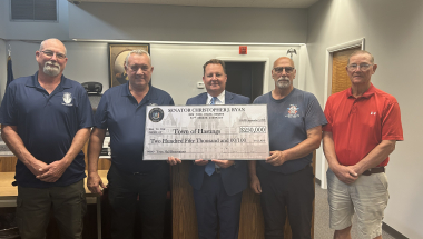 Senator Ryan presenting a check to Hastings Town Supervisor Town Bush and the Town Board