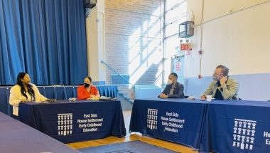 Legislators at table with childcare providers