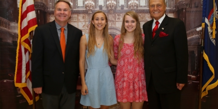 Senator Bonacic is pictured with (L-R), Principal Michael Rheaume, Salutatorian Kathryn Warren, and Valedictorian Sara Kovatch.