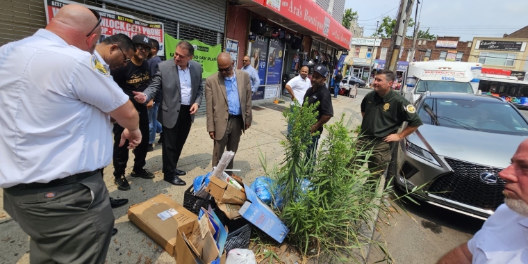 Addabbo and DSNY inspect trash on the walkthrough.