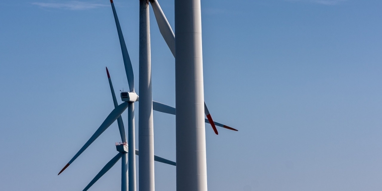 photo of a row of wind turbines 
