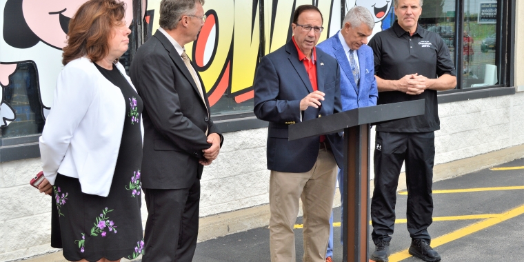 New York State Sen. Joseph Griffo, center, speaks at a news conference.