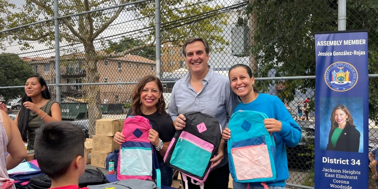 Senator Gianaris, Assembly Member Gonazalez-Rojas, and Council Member Cabán pose with backpacks