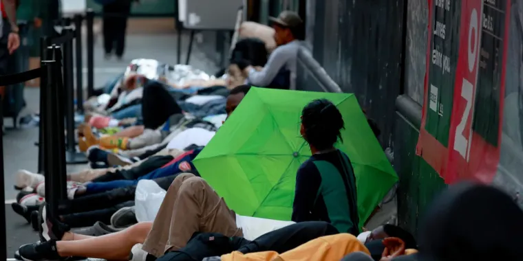 Hundreds of migrants are seen sleeping outside the Roosevelt Hotel in Midtown Manhattan early Monday July 31, 2023. Asylum seekers are camping outside the Roosevelt Hotel as the Manhattan relief center is at capacity.  (Photo by: Luiz C. Ribeiro for New York Daily News)
