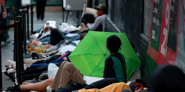 Hundreds of migrants are seen sleeping outside the Roosevelt Hotel in Midtown Manhattan early Monday July 31, 2023. Asylum seekers are camping outside the Roosevelt Hotel as the Manhattan relief center is at capacity. (Photo by: Luiz C. Ribeiro for New York Daily News)