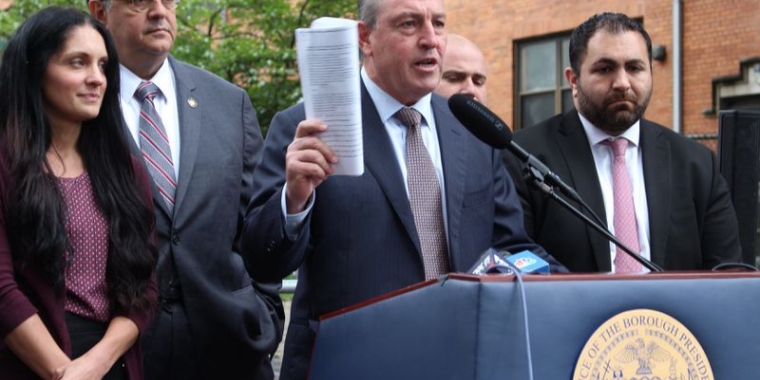 A group of Staten Island elected officials gathered outside the former St. John Villa Academy on Tuesday, Sept. 26, to ask City Hall not to appeal a recent court ruling that bars the former school building from being used as a migrant shelter. (Staten Island Advance/Erik Bascome)