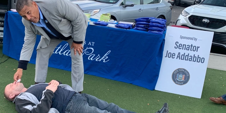 Luis Laboy, the senior administrator of residential programs at Acacia Network demonstrate how to administer Naloxone on J-CAP volunteer, Oleg Ryazanov.