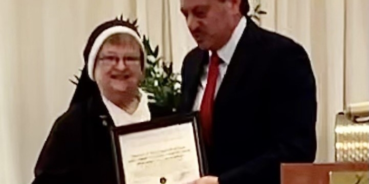 Senator Joseph P. Addabbo, Jr. presented Sr. Francis Marie Wystepek, Principal of Divine Mercy Catholic Academy in Ozone Park, with a Senate citation.