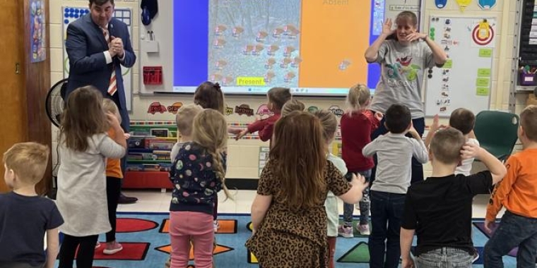 Senator Mannion leads Volney students in an activity on the whiteboard with the help of teacher Jennifer Kerfien