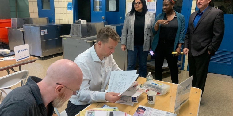 Senator Joe Addabbo joins Counncilwoman Joann Ariola and Monique Francis, Interim Executive Director, CUNY Citizenship Now! as they view team members hard at work reviewing applications.