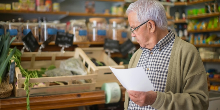 older man in grocery store