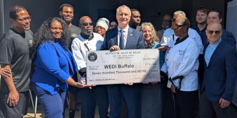 Senator Sean Ryan presents check for $700,000 to pay for kitchens at Manna @ Main, May 16, 2025