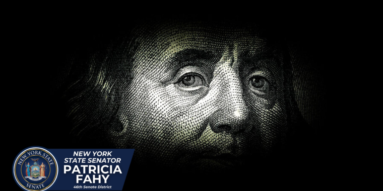 Ben Franklin/$100 note in dark background