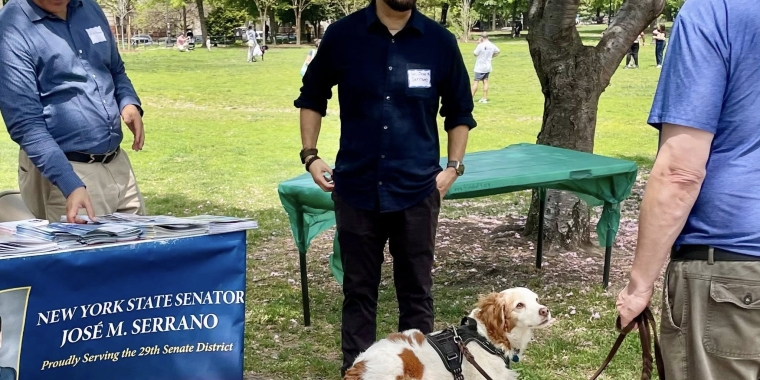 Senator Serrano talking to constituents at friends of 4 parks community social