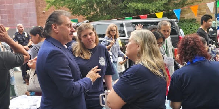 Senator Addabbo speaks with Community Board 6 Chairwoman Heather Beers-Dimitriadis at the National Night Out Event hosted by the 112th Precinct.