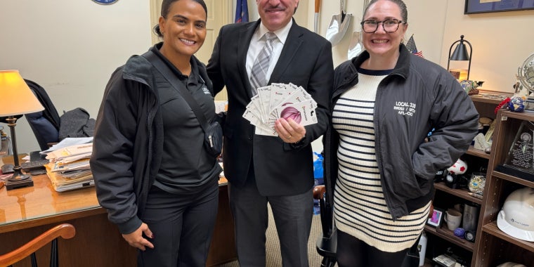 Senator Joseph P. Addabbo, Jr. receives gift cards for the community from Local 338 RWDSU Representatives.