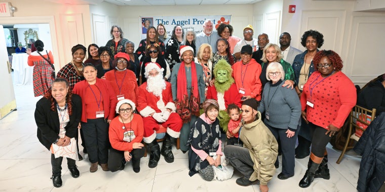 Senator Stewart-Cousins with Santa, the Grinch, Angels and Grandparents